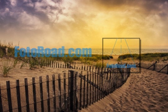 Beach with wooden fence and beautiful ocean view