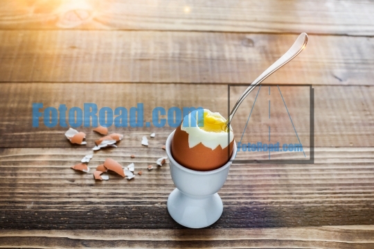 Boiled egg on wooden table ready to eat