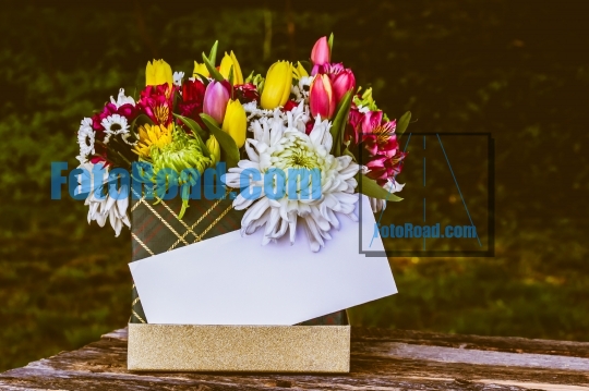 Box with beautiful flovers and white space for text 