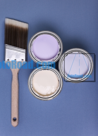 Brush and paint cans  on blue background