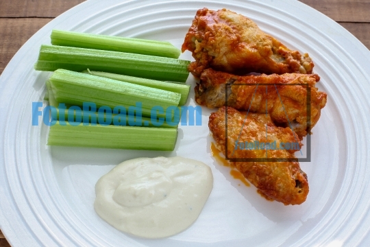 Buffalo chicken wings with celery and blue cheese