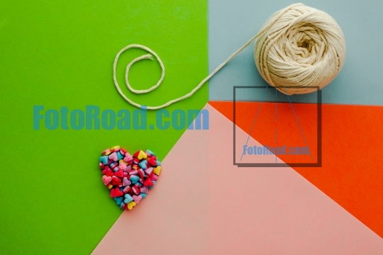 Colorful abstract background with candy hearts and rope