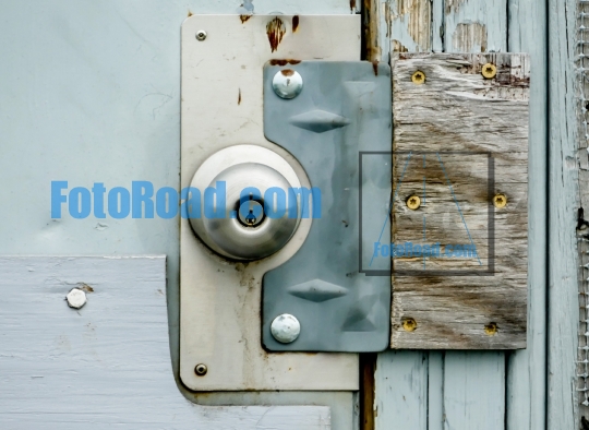 Door knob background on wooden door close up