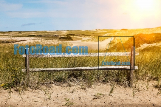 Fence with sand dunes view