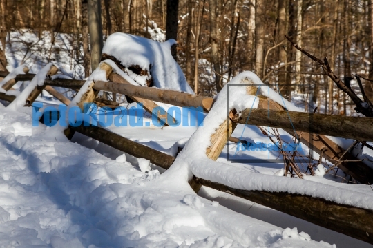 Fence with snow after blizzard