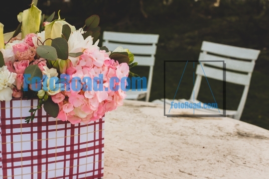 Flowers in gift box outside on table