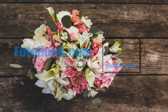 Flowers on wooden table with text space