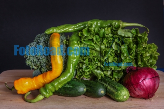 Healthy vegetables on wooden cutting board