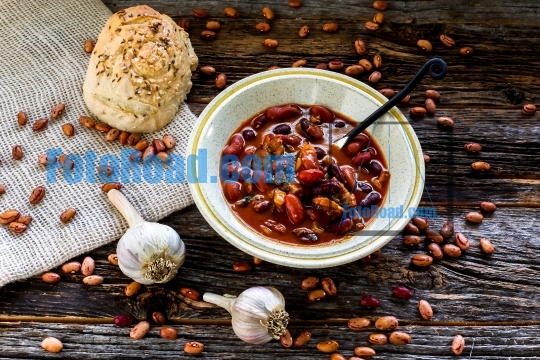 Mountain man rustic table with beans and sausage soup