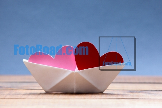 Paper hearts inside paper boat