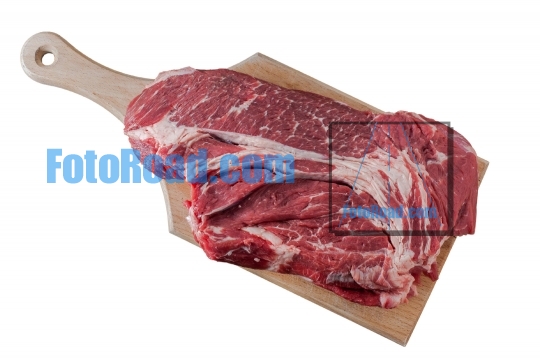 Raw beef meat on cutting board isolated on white background