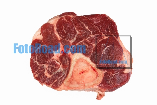 Raw beef with bone on white background