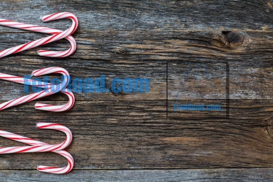Rustic wood with candy canes background