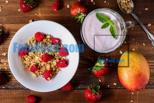 Strawberry smoothie with granola berries and mango table top vie