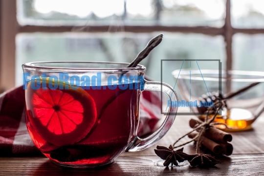 Tea with lemon on table with windows  view