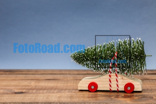 Wooden car with christmas tree