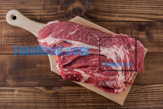 Beef meat on cutting board