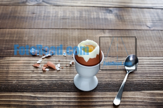 Boiled egg on wooden table ready to eat