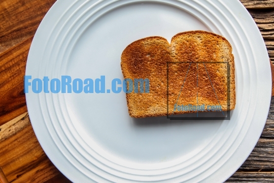 Golden toast on white plate